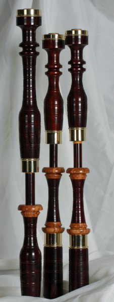 Original profile in cocobolo with Olive wood projecting mounts, and bronze beaded ferrules.